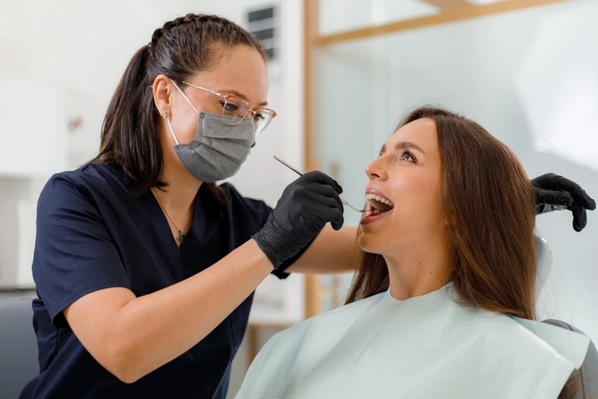 Dentist examining a patient's teeth.