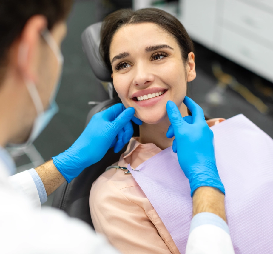 Rectangle 59 (3) Dentist examining patient's smile in clinic.
