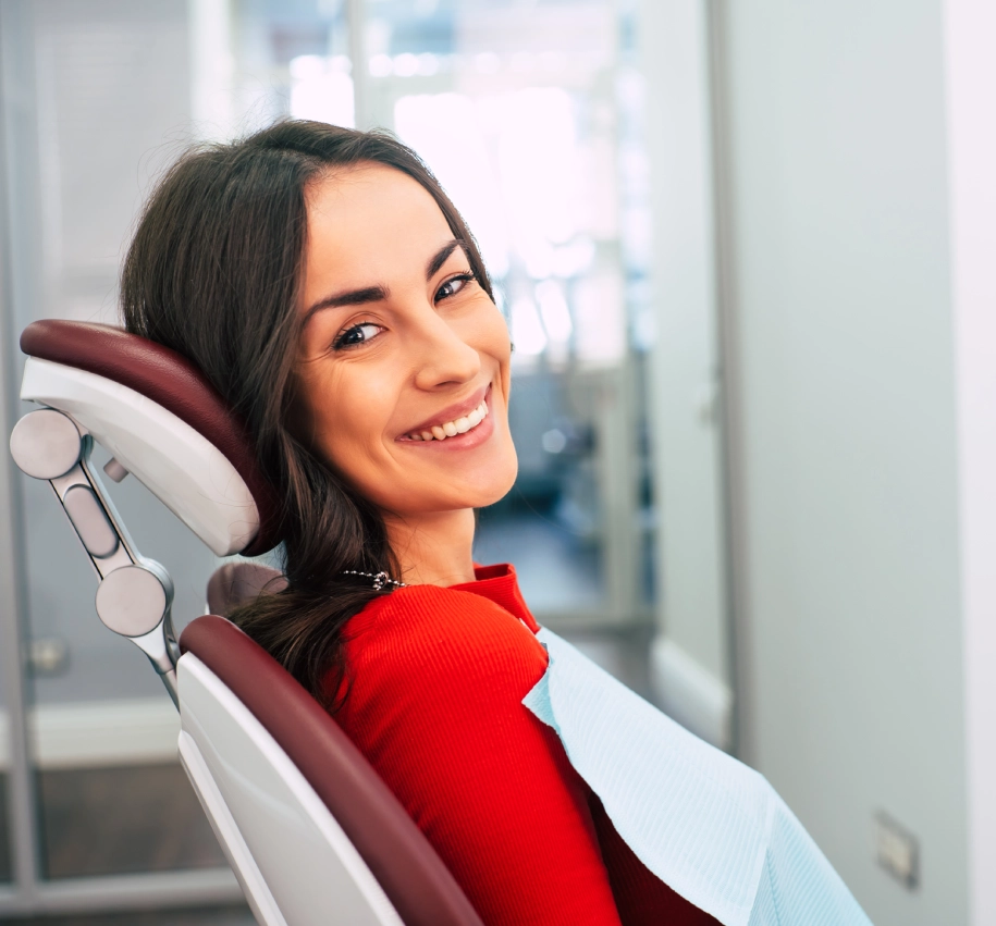 Rectangle 59 (6) Woman smiling in a dental chair.
